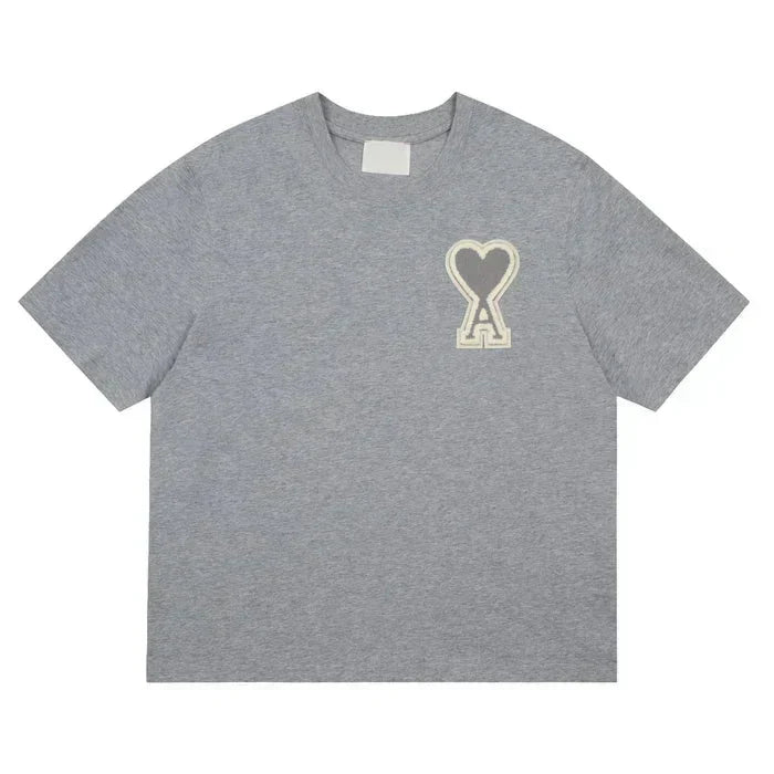 https://cdn.shopify.com/s/files/1/0901/0413/6028/files/ami-heart-tee-434653.webp?v=1743324151